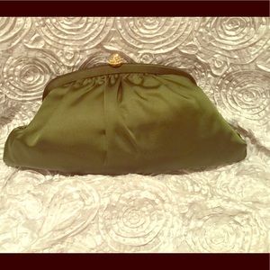 Satin party clutch with rhinestone clasp.
